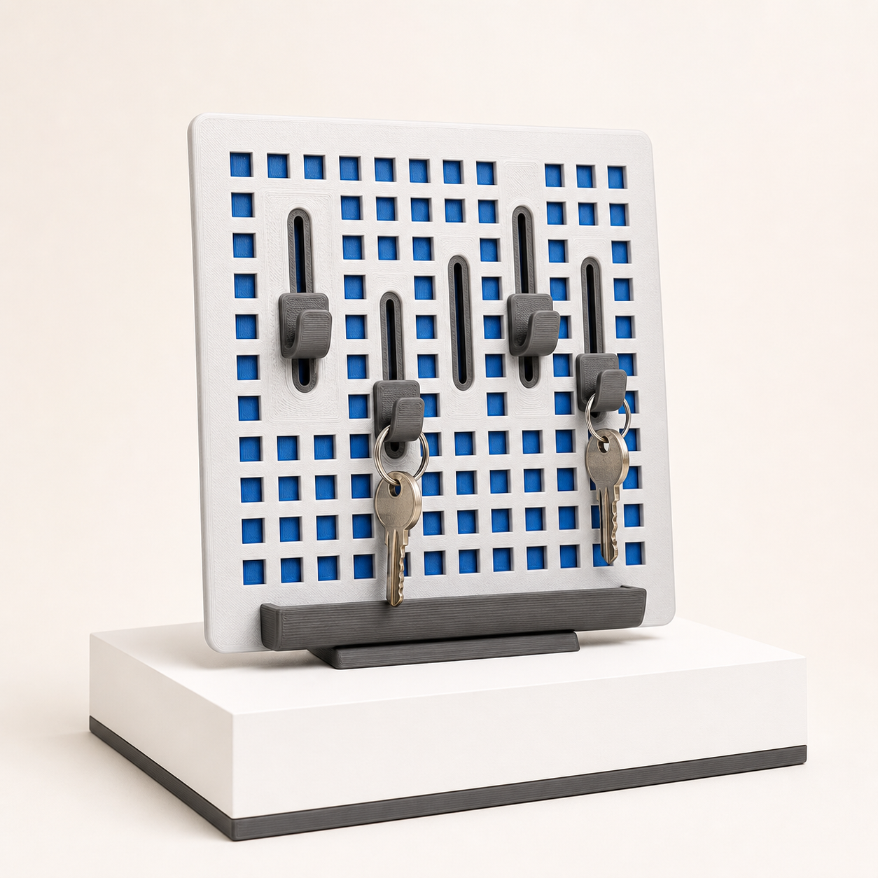 Porta-chaves Grid, produto impresso em 3D sobre base de exposição